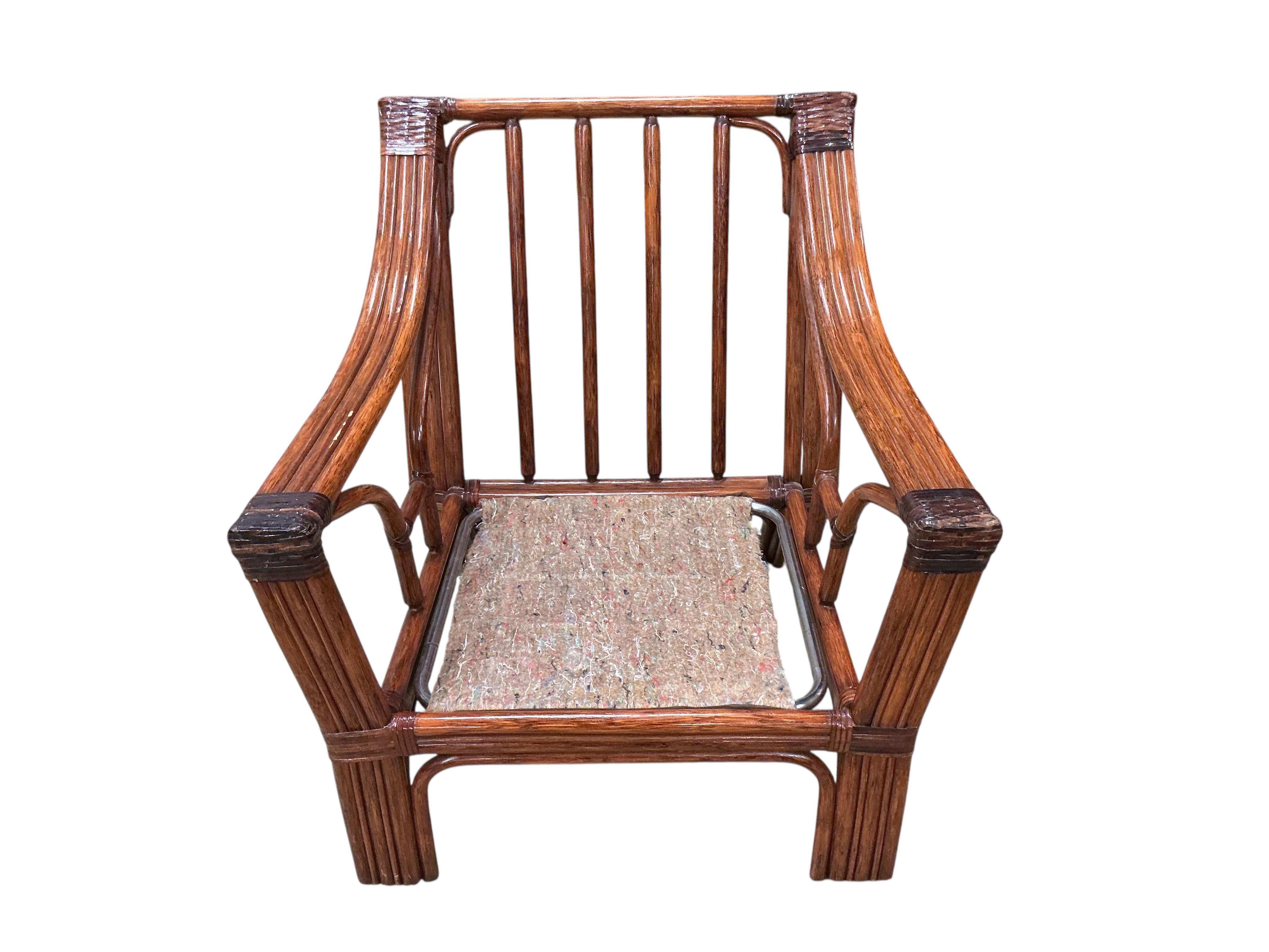 A mid century Roche Bobois faux bamboo three piece suite, lacking some cushions